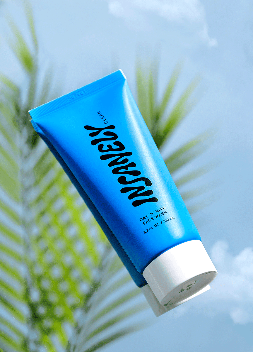 The best natural face wash for men against a tropical backdrop – your key to glowing skin for men because men have skin too.