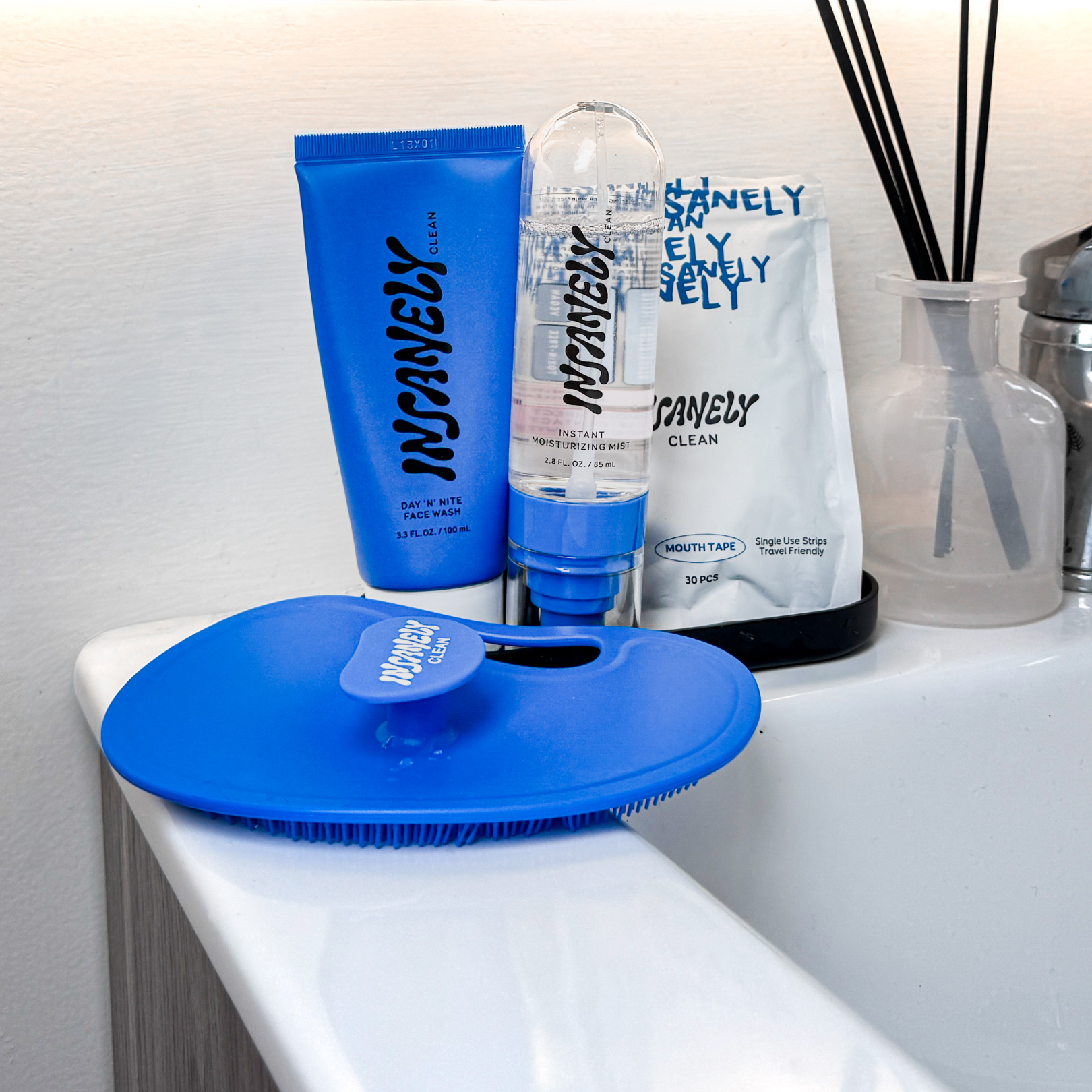 Insanely Clean Day 'N' Nite Face Wash, Insanely Clean Instant Moisturizing Mist, Insanely Clean Body Scrubber, and Insanely Clean Mouth Tape
