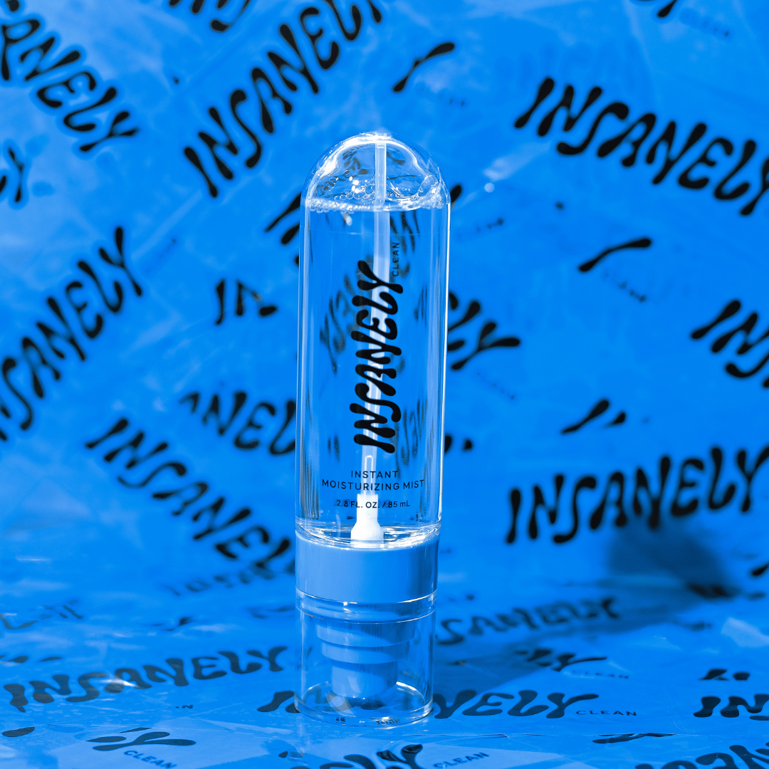 A close-up of Insanely Clean's Instant Moisturizing Mist set against a background covered in Insanely Clean tape.