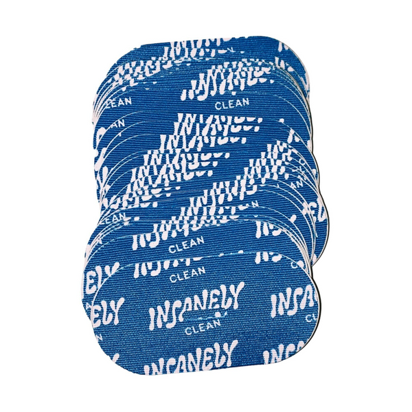 A close-up of several strips inside the Insanely Clean Mouth Tape package, designed to energize, control snoring, and enhance your profile naturally—ensuring a peaceful night's sleep.