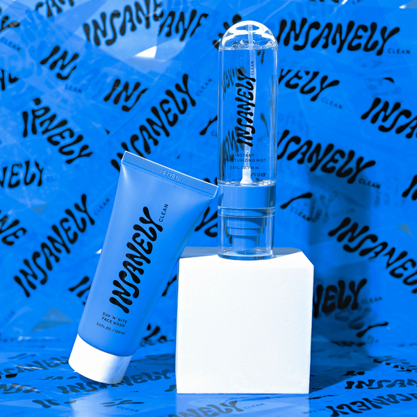 The Insanely Clean Day 'N' Nite Face Wash and Instant Moisturizing Mist, set against a backdrop of blue tape featuring the Insanely Clean logo.