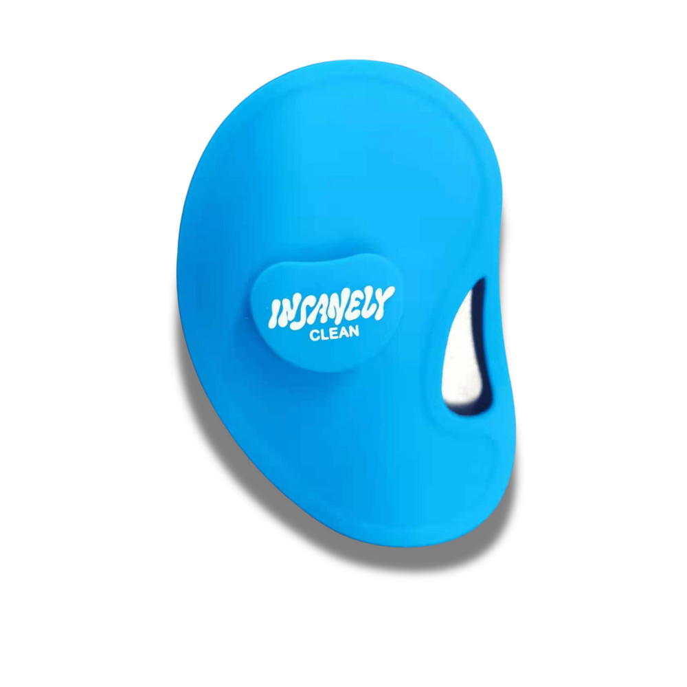 A close-up of the back of Insanely Clean's men's silicone blue face and body brush.